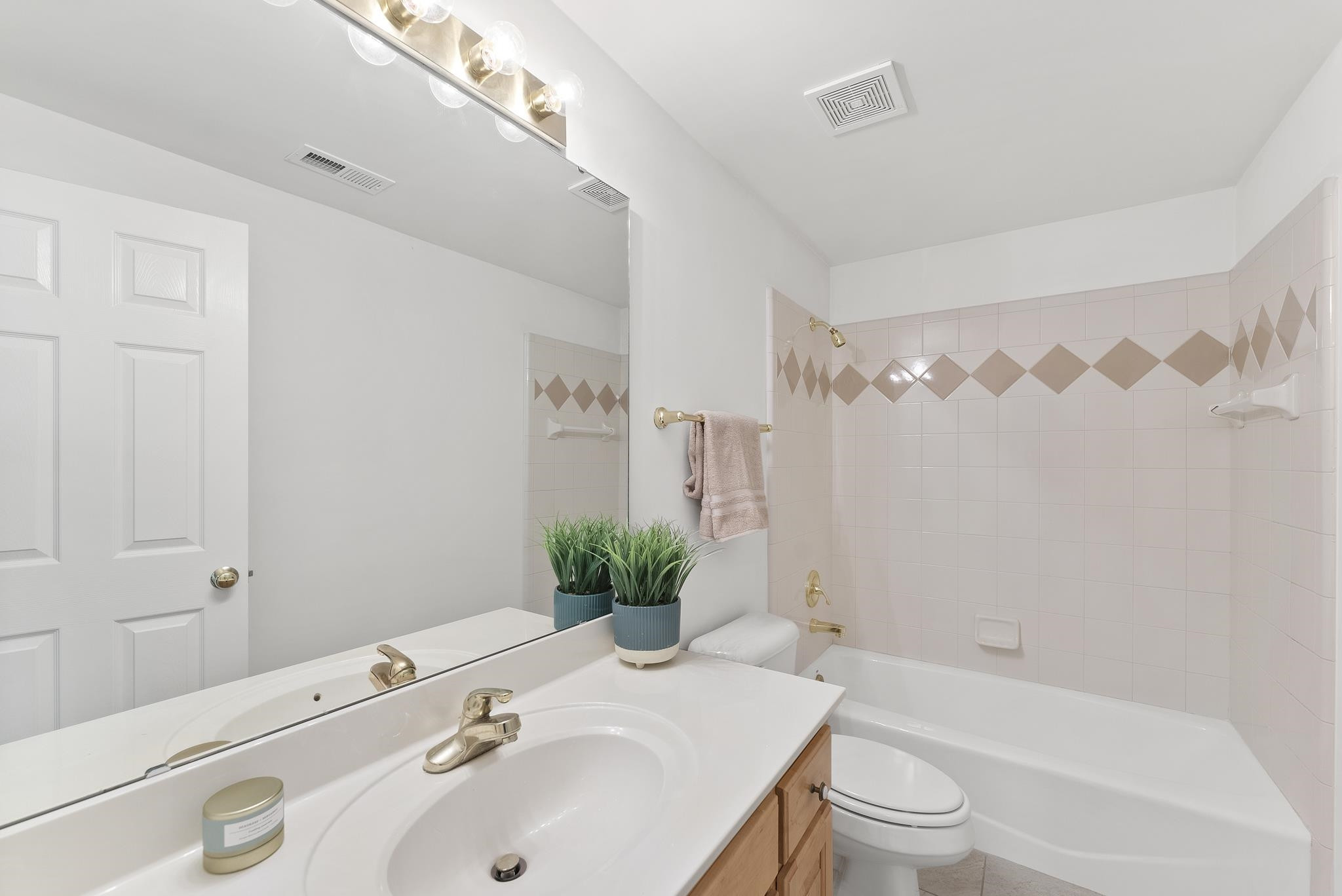 9436 Macon Road Raleigh, NC 27613 - Photo 34 of 37 a bathroom with a sink toilet and shower