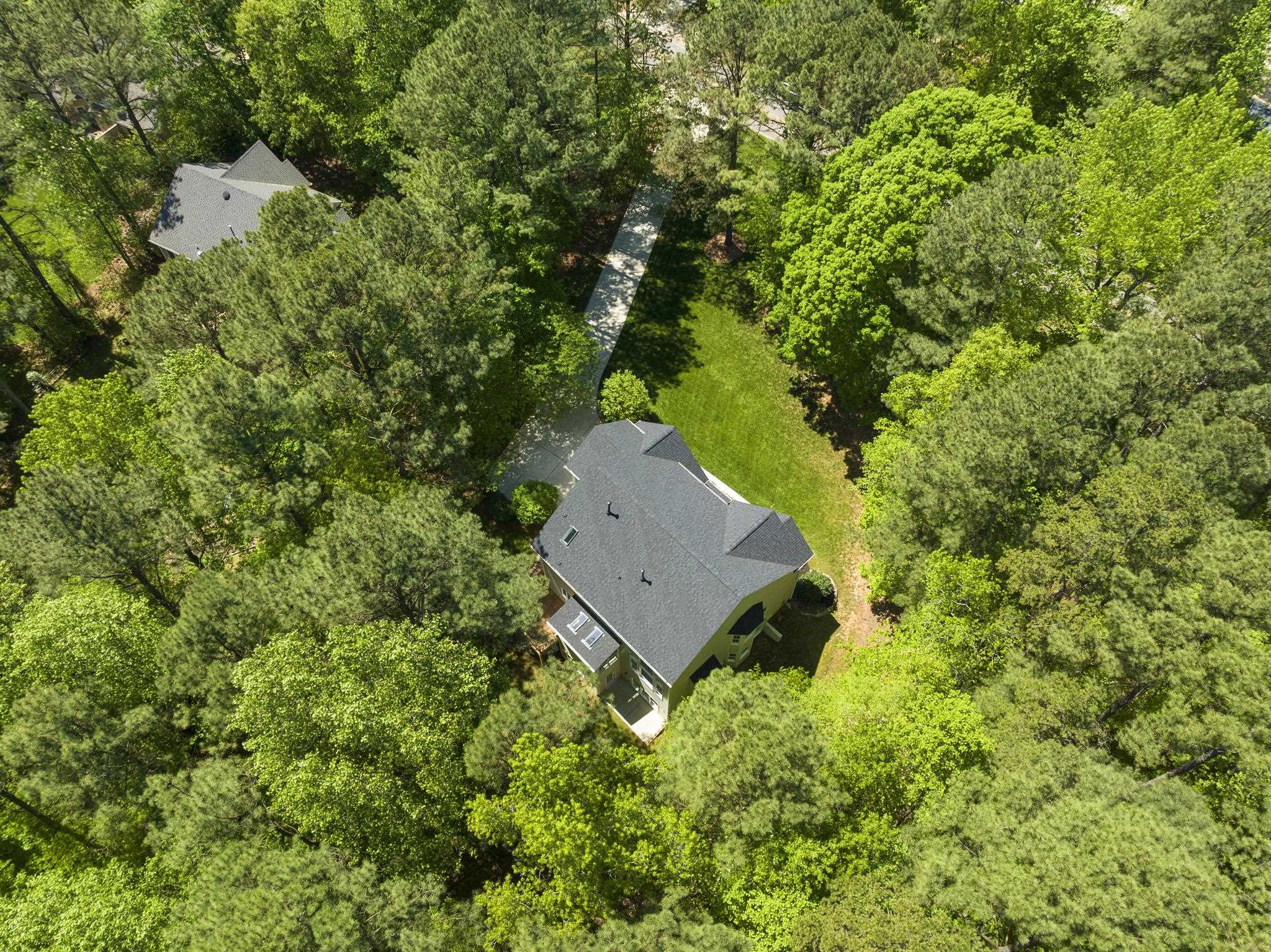 9436 Macon Road Raleigh, NC 27613 - Photo 6 of 37 an aerial view of a house with a yard and outdoor seating