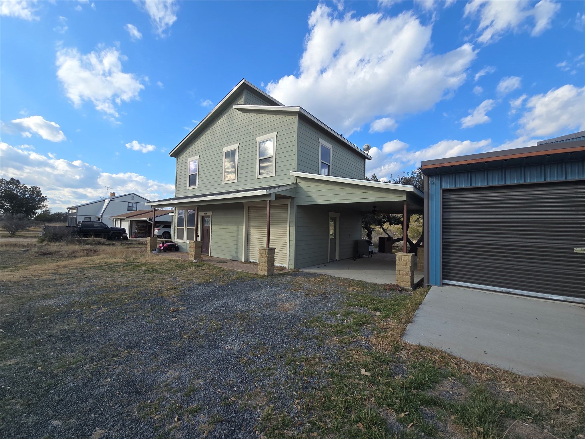 304 Spring Street Burnet, TX 78611 - Photo 1 of 11 a view of a house with a yard