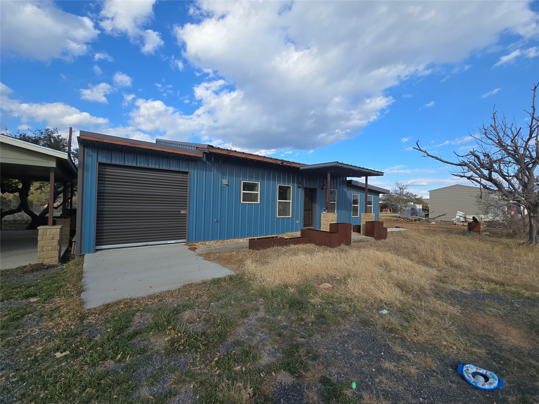 304 Spring Street Burnet, TX 78611 - Photo 4 of 11 a view of a house with a yard