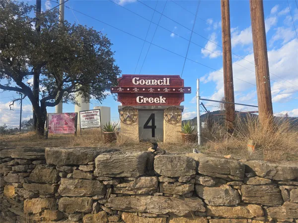 a view of a street with benches