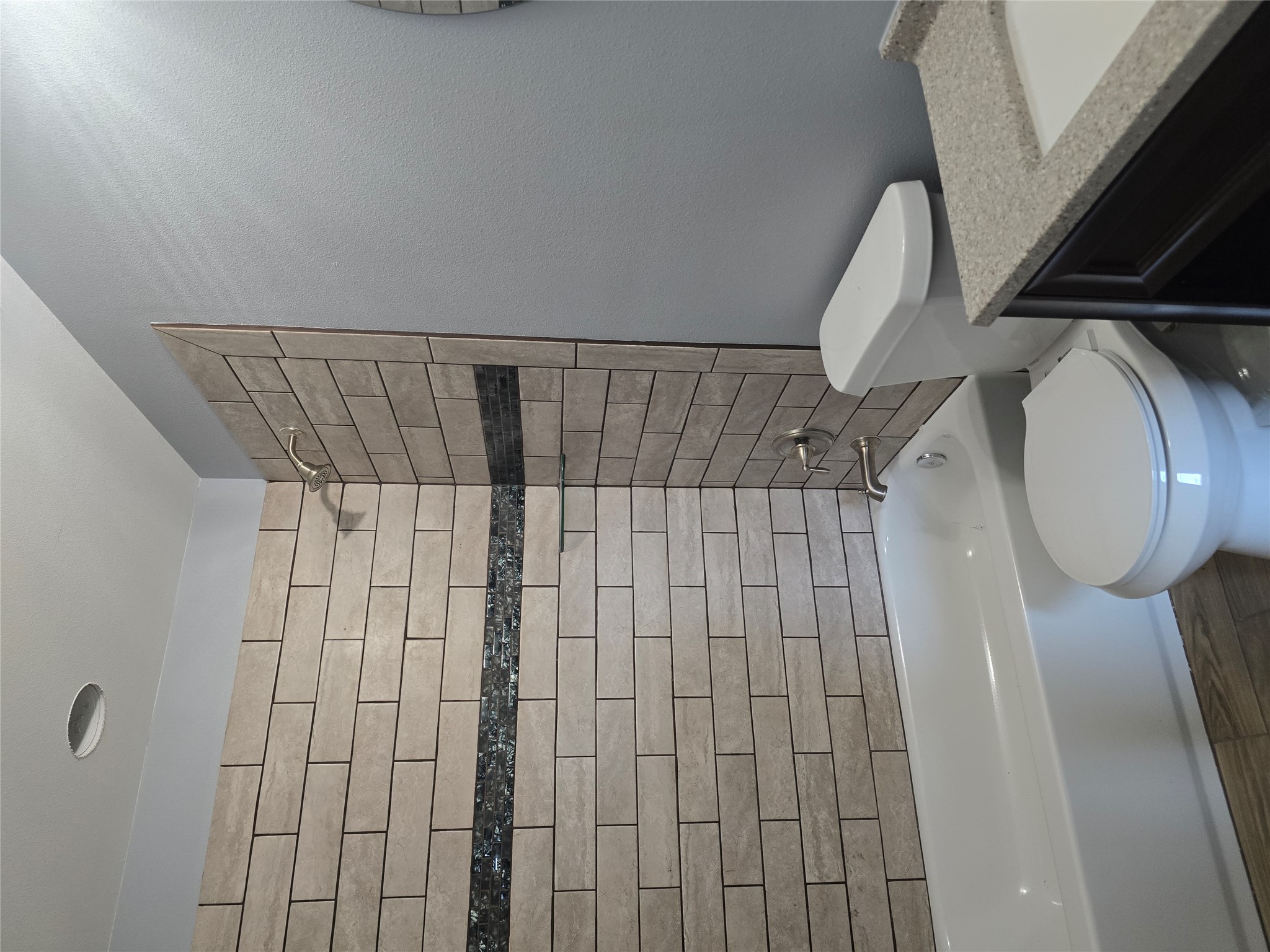 304 Spring Street Burnet, TX 78611 - Photo 7 of 11 a bathroom with a toilet and a bathtub