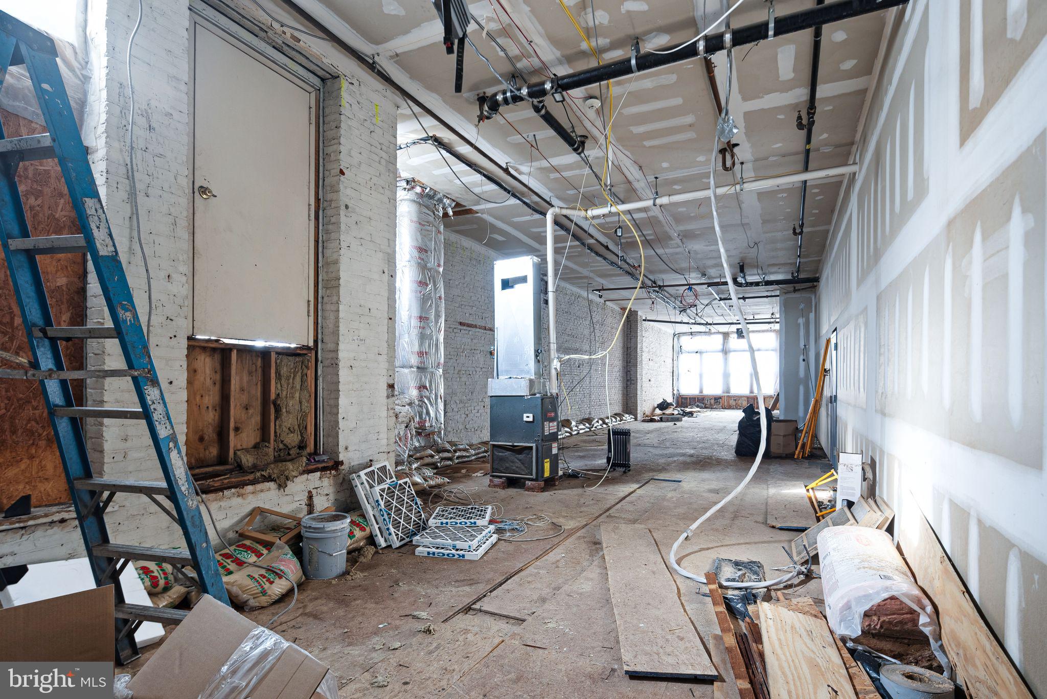 20 Letitia Street, Unit 2B Philadelphia, PA 19106 - Photo 3 of 9 a room with lots of chairs and windows