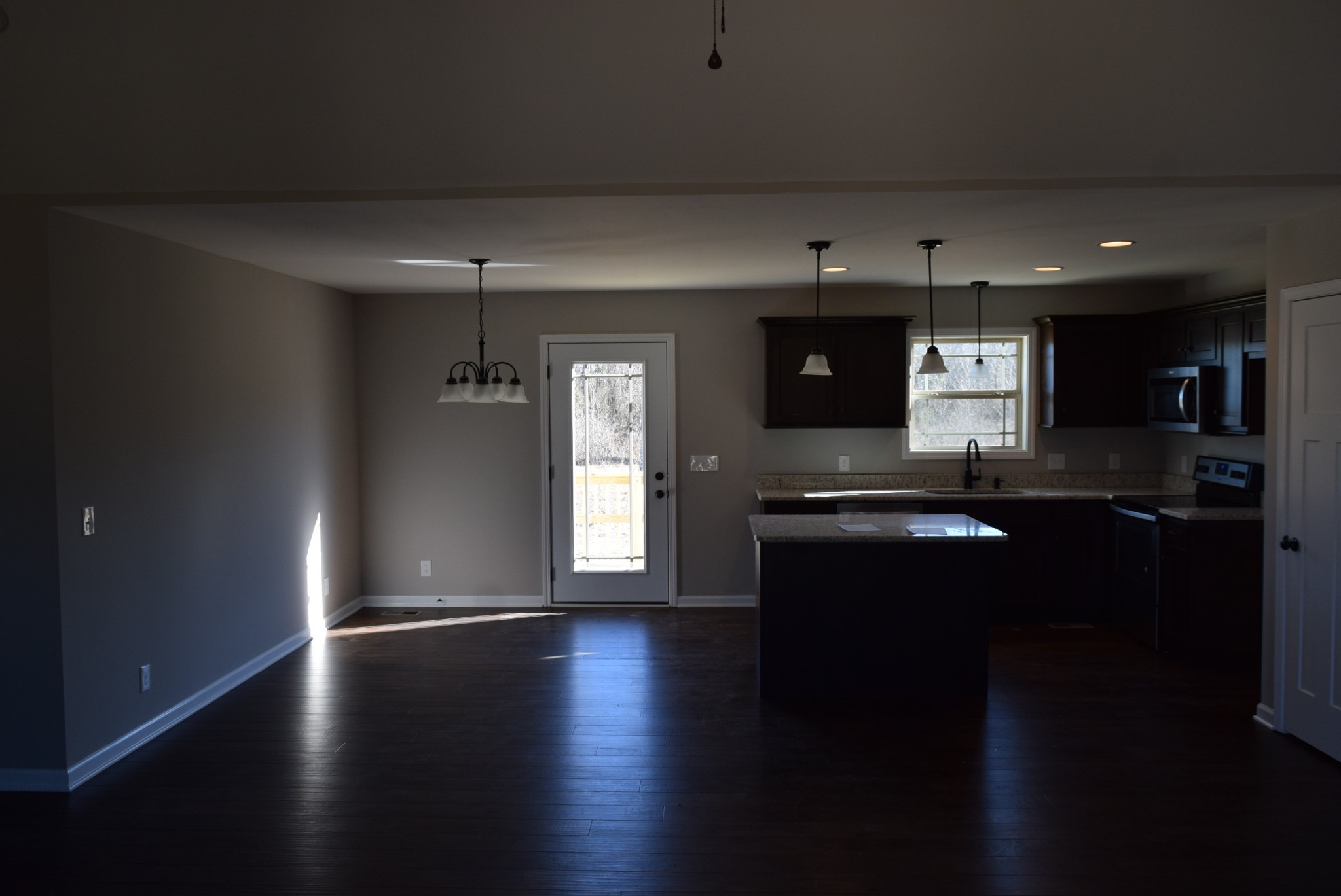 21 Ballard Road Manchester, TN 37355 - Photo 2 of 9 a kitchen with stainless steel appliances granite countertop a stove a sink and a microwave