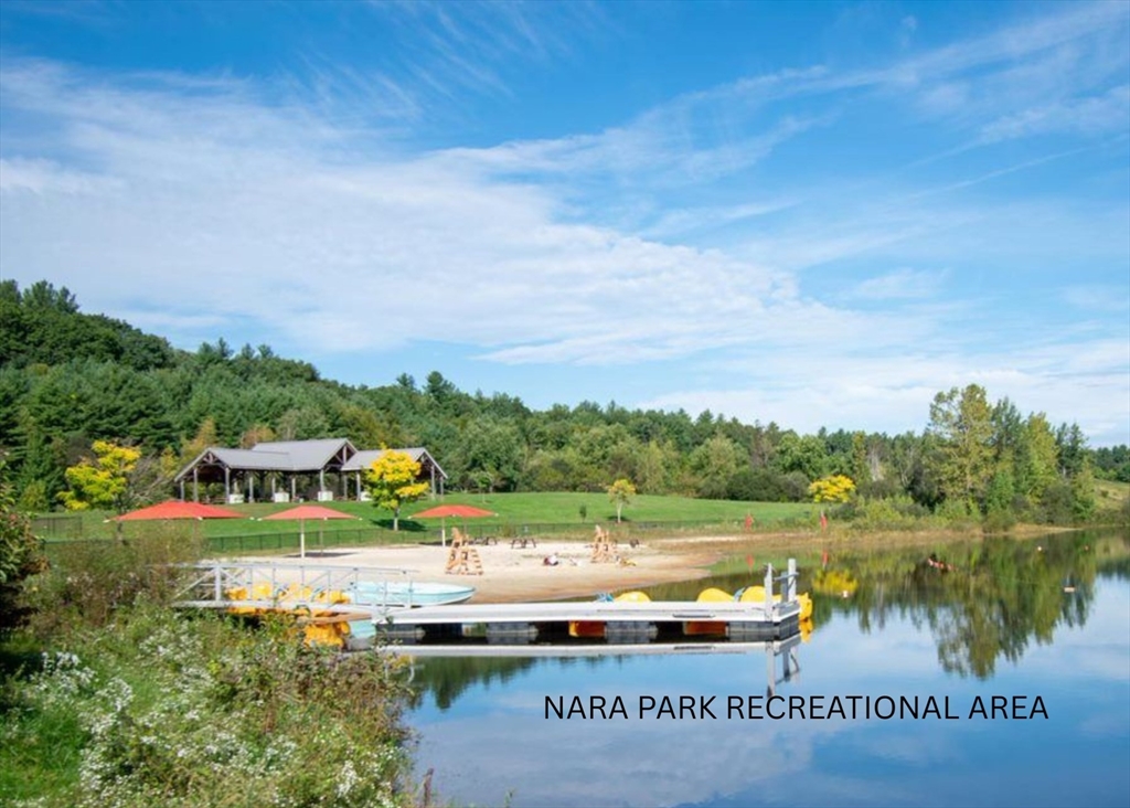 Lot 1 Quarry Road Acton, MA 01720 - Photo 4 of 11 a view of a lake with houses in the back