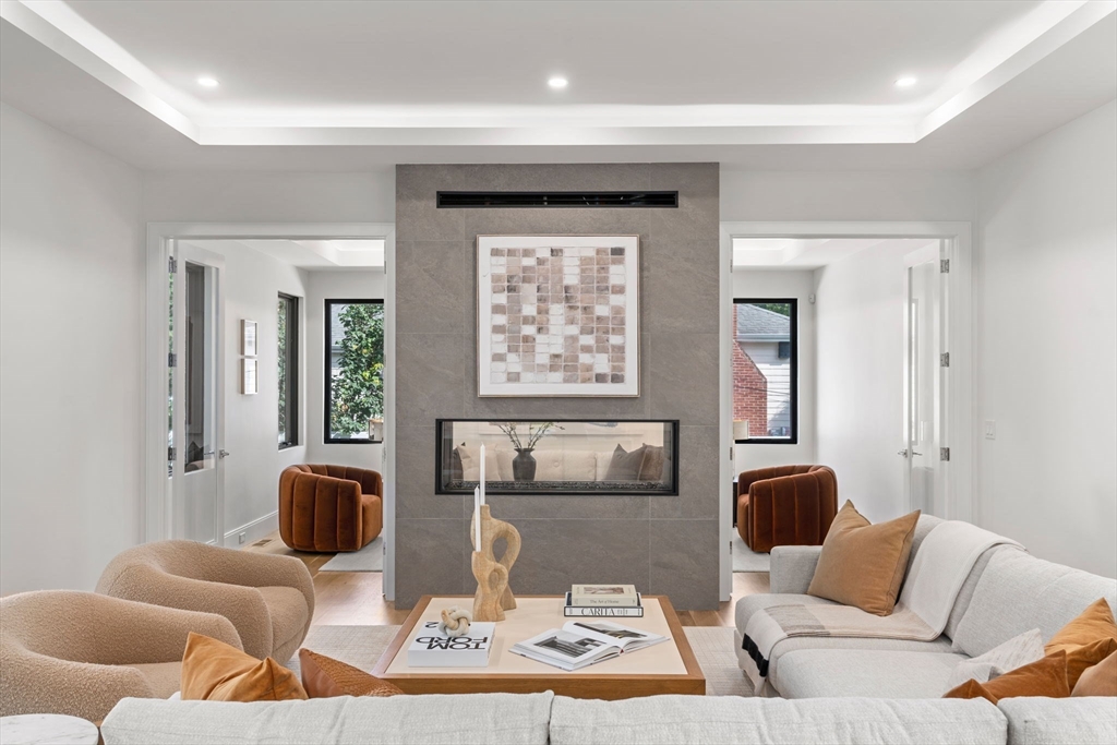 29 Levbert Road Newton, MA 02459 - Photo 11 of 40 a living room with furniture and a large window