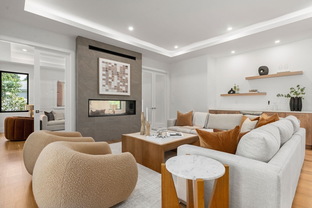 29 Levbert Road Newton, MA 02459 - Photo 12 of 40 a living room with furniture and a large window