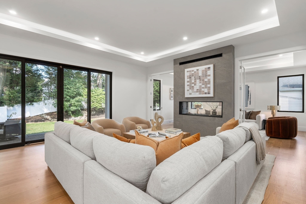 29 Levbert Road Newton, MA 02459 - Photo 13 of 40 a living room with furniture and a large window