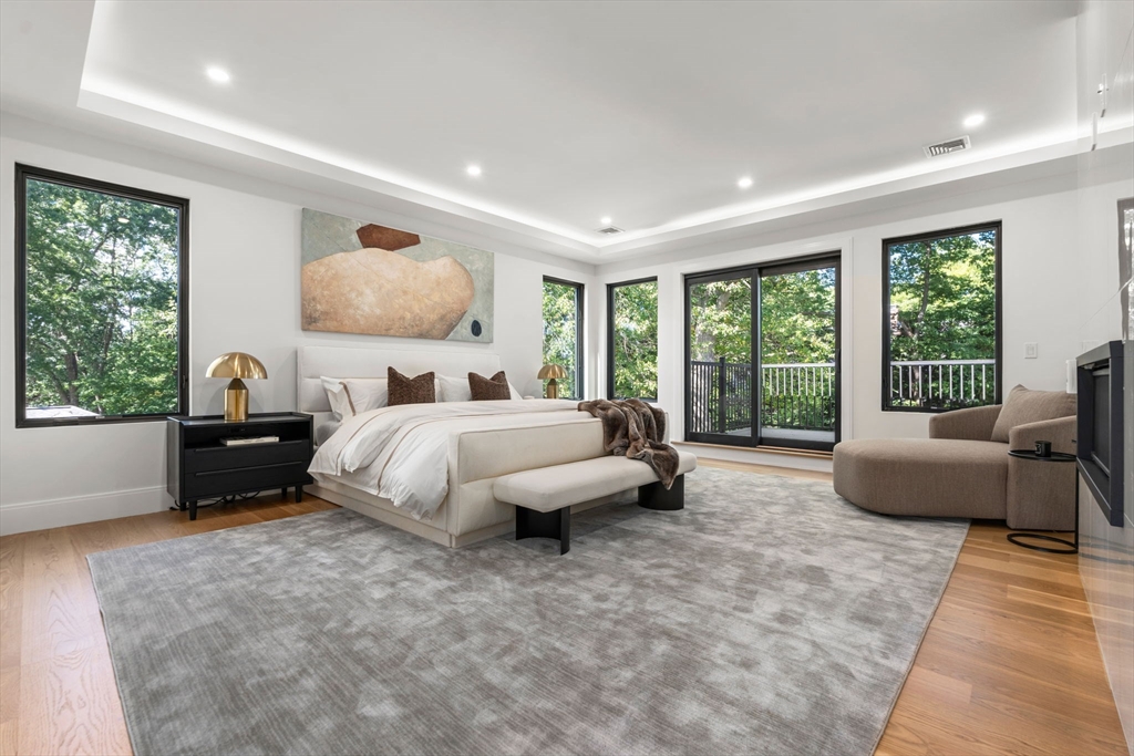 29 Levbert Road Newton, MA 02459 - Photo 20 of 40 a bed room with a bed and a couch