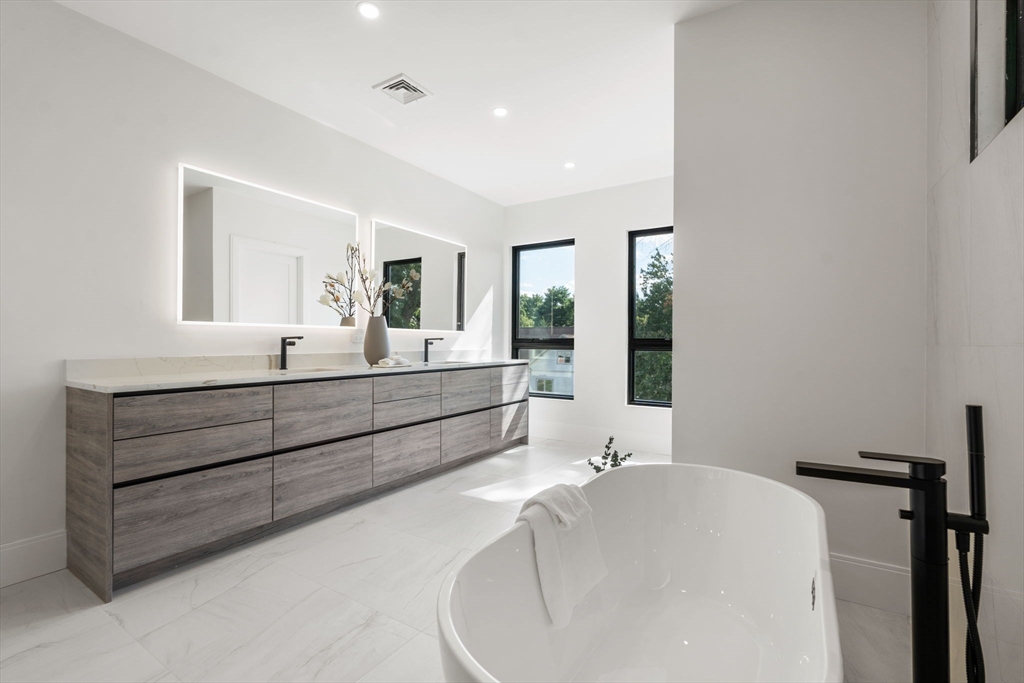 29 Levbert Road Newton, MA 02459 - Photo 23 of 40 a bathroom with a bathtub and a sink