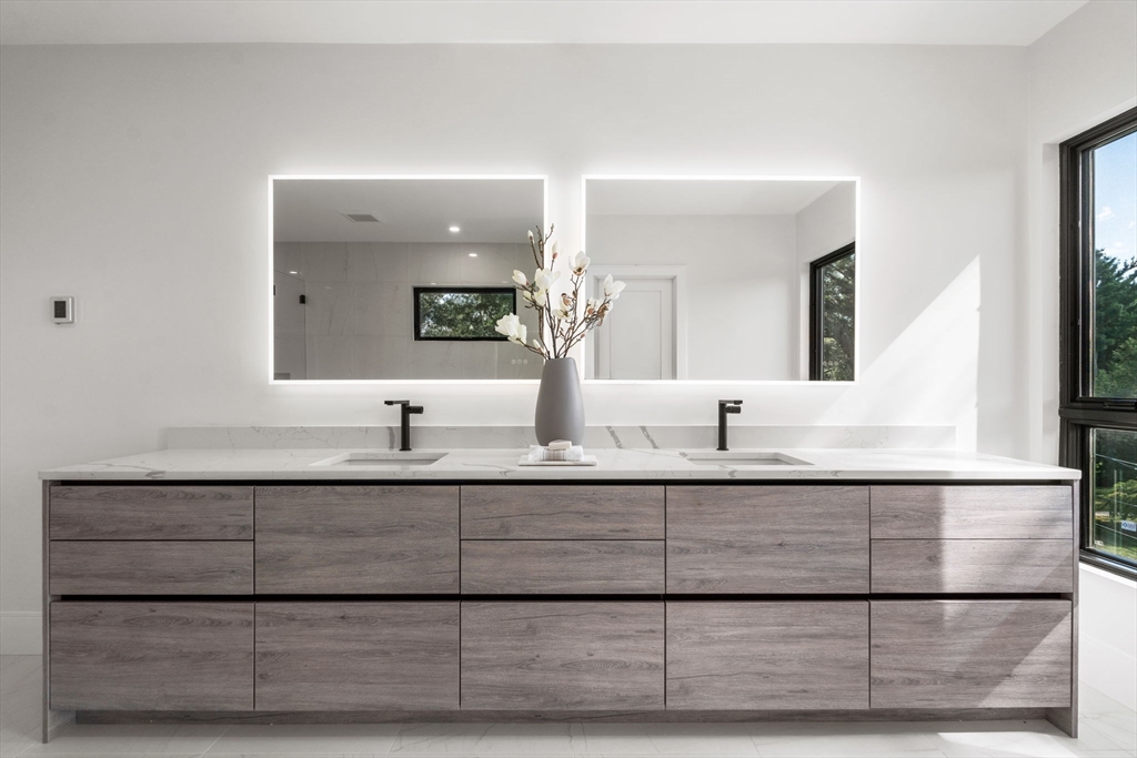 29 Levbert Road Newton, MA 02459 - Photo 24 of 40 a bathroom with a sink and a mirror