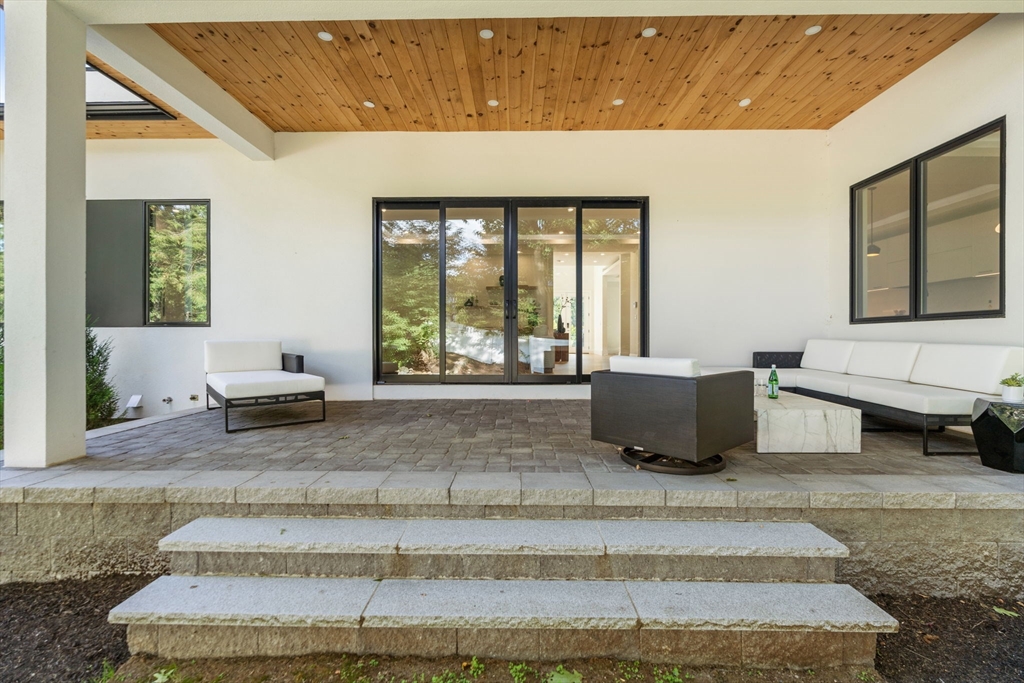 29 Levbert Road Newton, MA 02459 - Photo 31 of 40 a living room with a couch and a large window