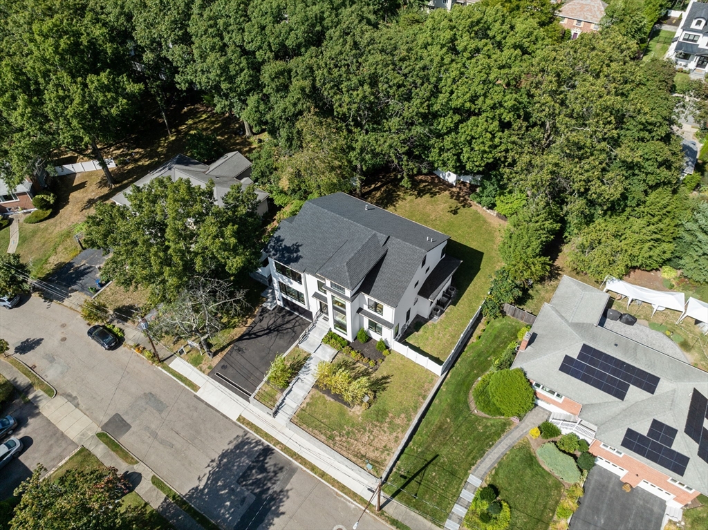 29 Levbert Road Newton, MA 02459 - Photo 37 of 40 an aerial view of a house with a garden and swimming pool