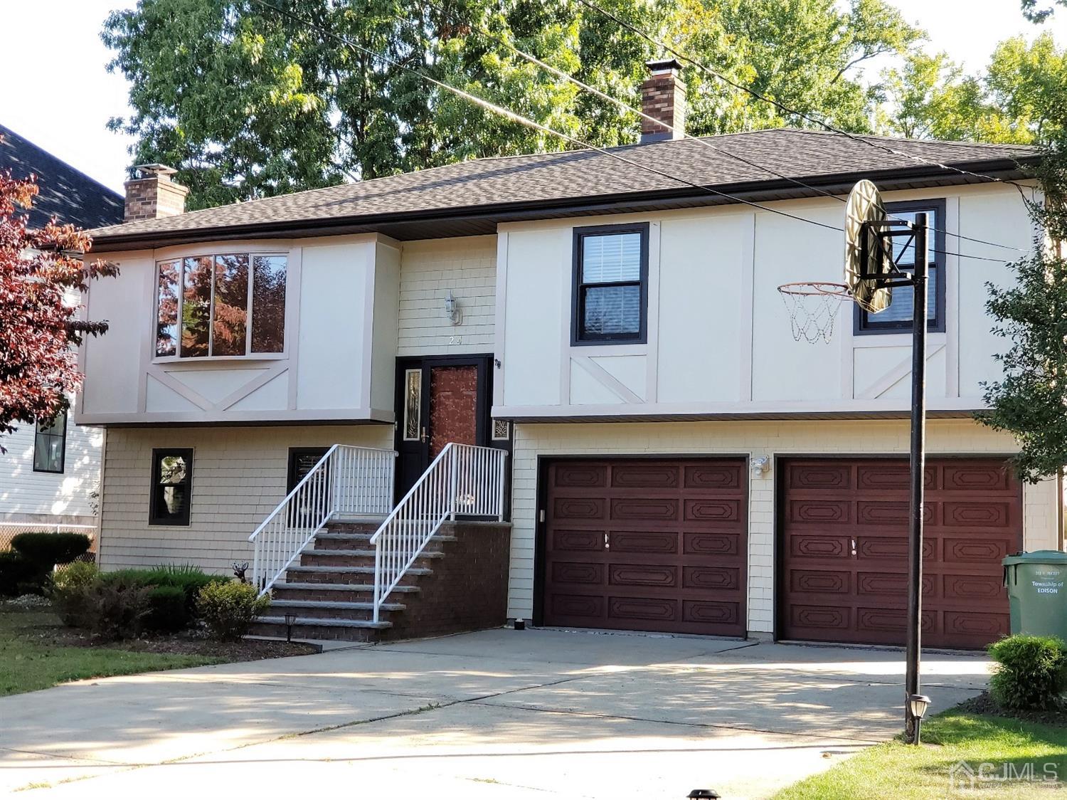24 Hillsdale Road Edison, NJ 08820 - Photo 1 of 41 a front view of a house with a garage