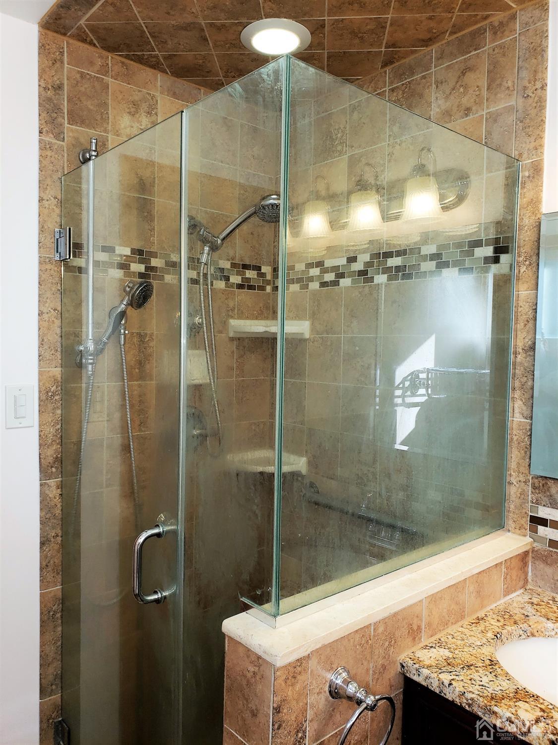 24 Hillsdale Road Edison, NJ 08820 - Photo 16 of 41 a bathroom with a shower