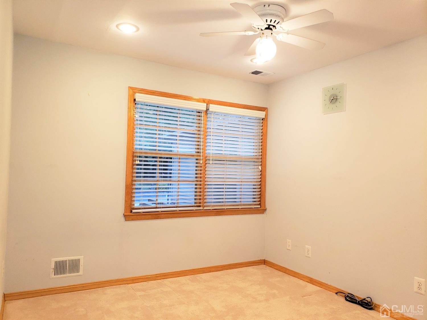 24 Hillsdale Road Edison, NJ 08820 - Photo 21 of 41 a view of an empty room with a window
