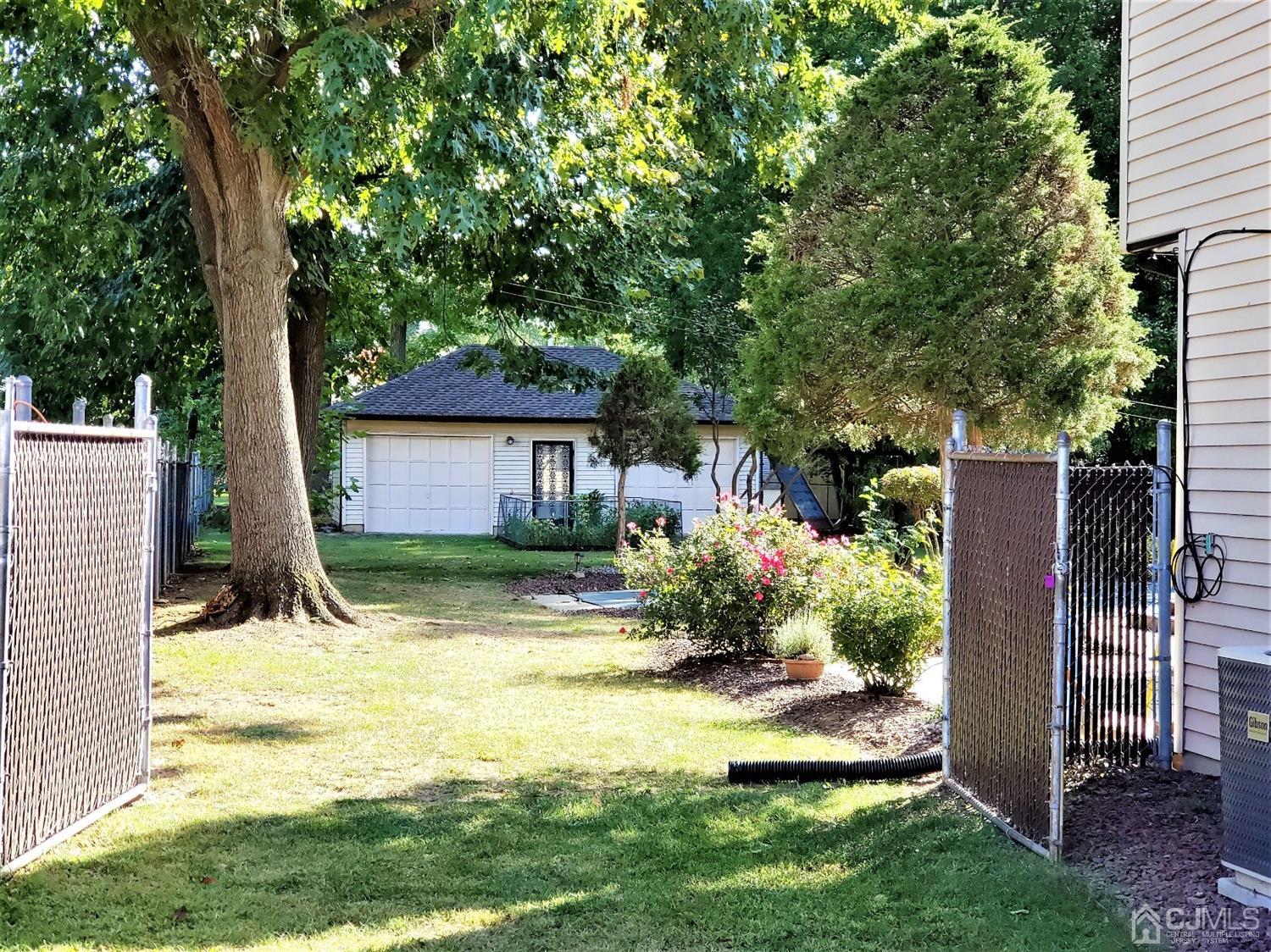 24 Hillsdale Road Edison, NJ 08820 - Photo 22 of 41 a view of a house with backyard and sitting area