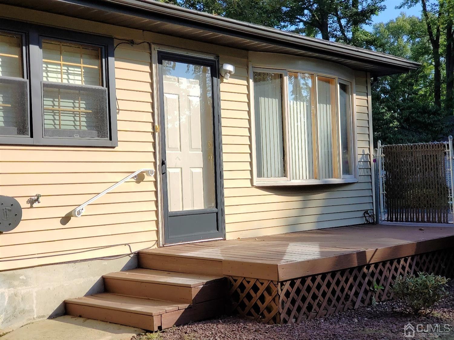24 Hillsdale Road Edison, NJ 08820 - Photo 32 of 41 a view of a house with a door and wooden floor
