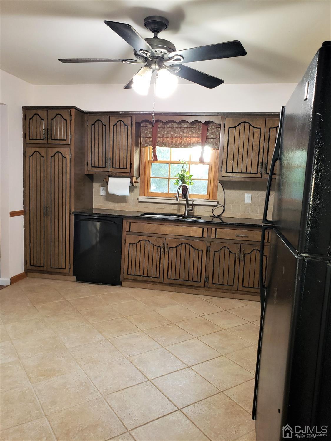 24 Hillsdale Road Edison, NJ 08820 - Photo 6 of 41 a kitchen with stainless steel appliances granite countertop a sink and a refrigerator