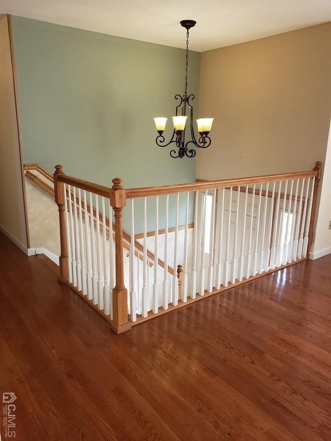 24 Hillsdale Road Edison, NJ 08820 - Photo 10 of 41 a view of a hall with wooden floor