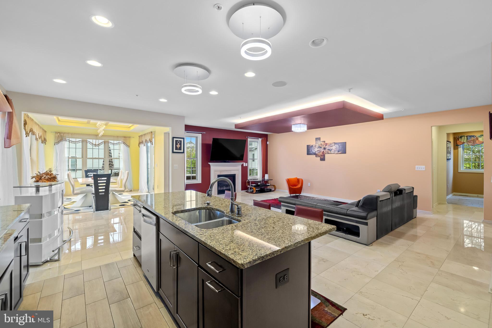 1116 Autumn Brook Avenue Silver Spring, MD 20906 - Photo 12 of 67 a kitchen with stainless steel appliances granite countertop a stove and a refrigerator