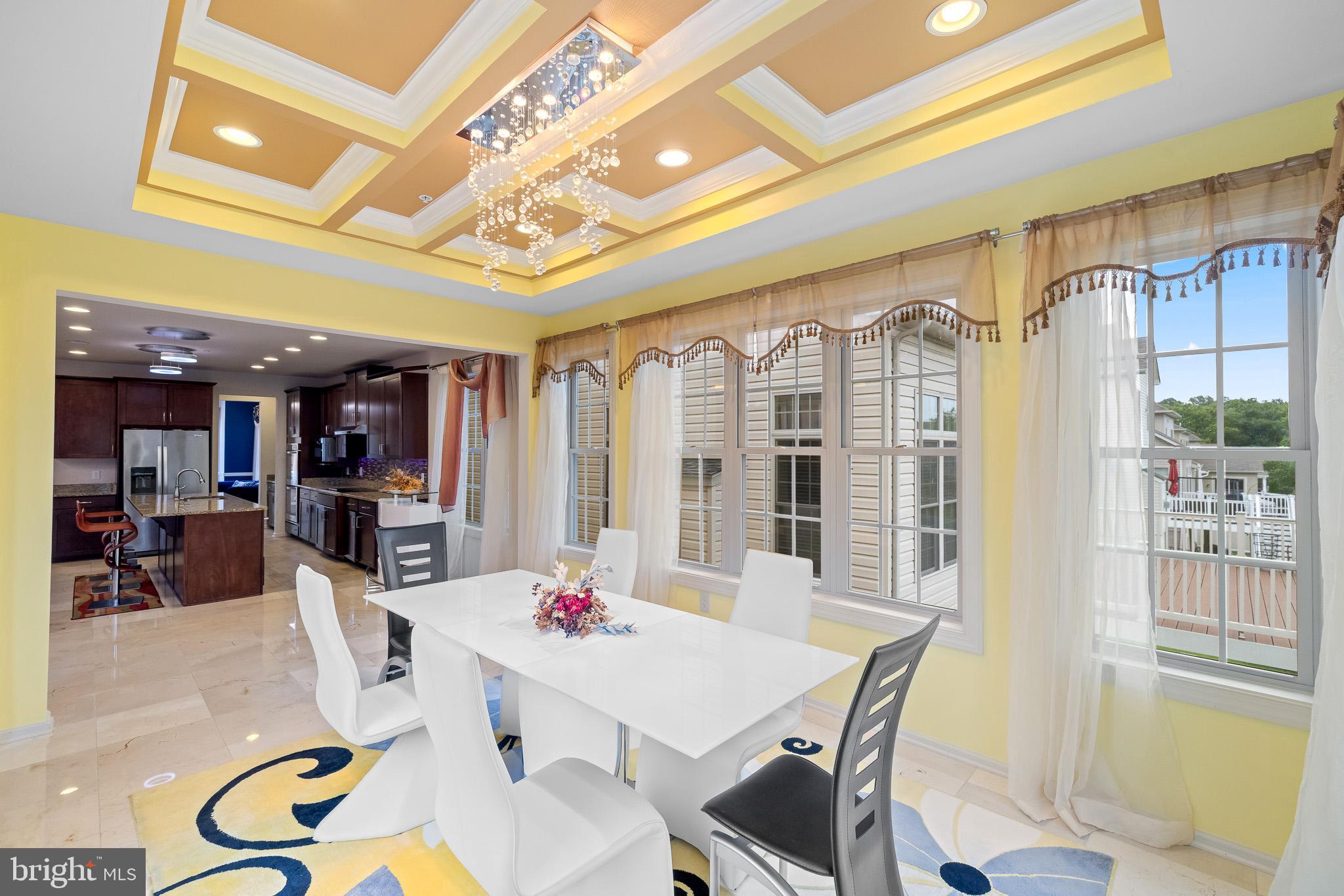 1116 Autumn Brook Avenue Silver Spring, MD 20906 - Photo 23 of 67 a dining room with furniture a chandelier and a rug