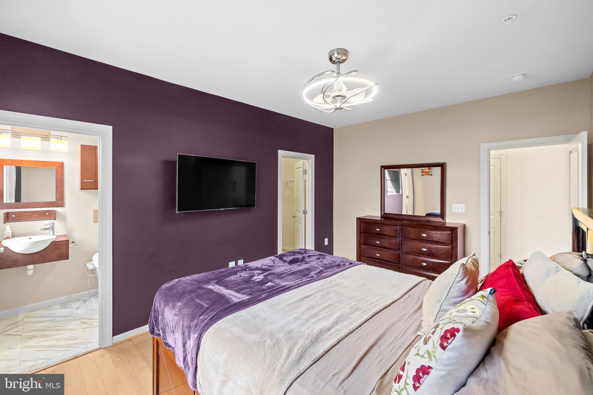 1116 Autumn Brook Avenue Silver Spring, MD 20906 - Photo 25 of 67 a bedroom with a bed and a flat screen tv