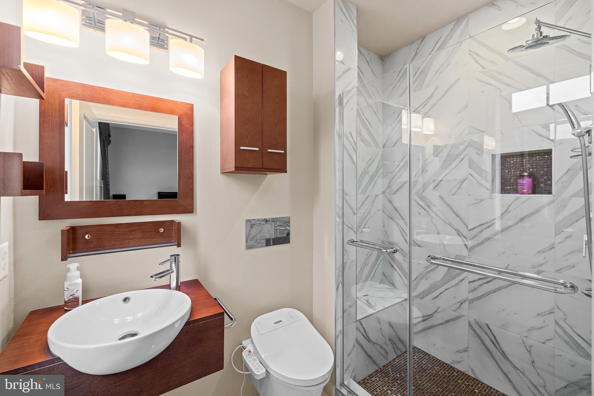 1116 Autumn Brook Avenue Silver Spring, MD 20906 - Photo 26 of 67 a bathroom with a toilet a sink and mirror