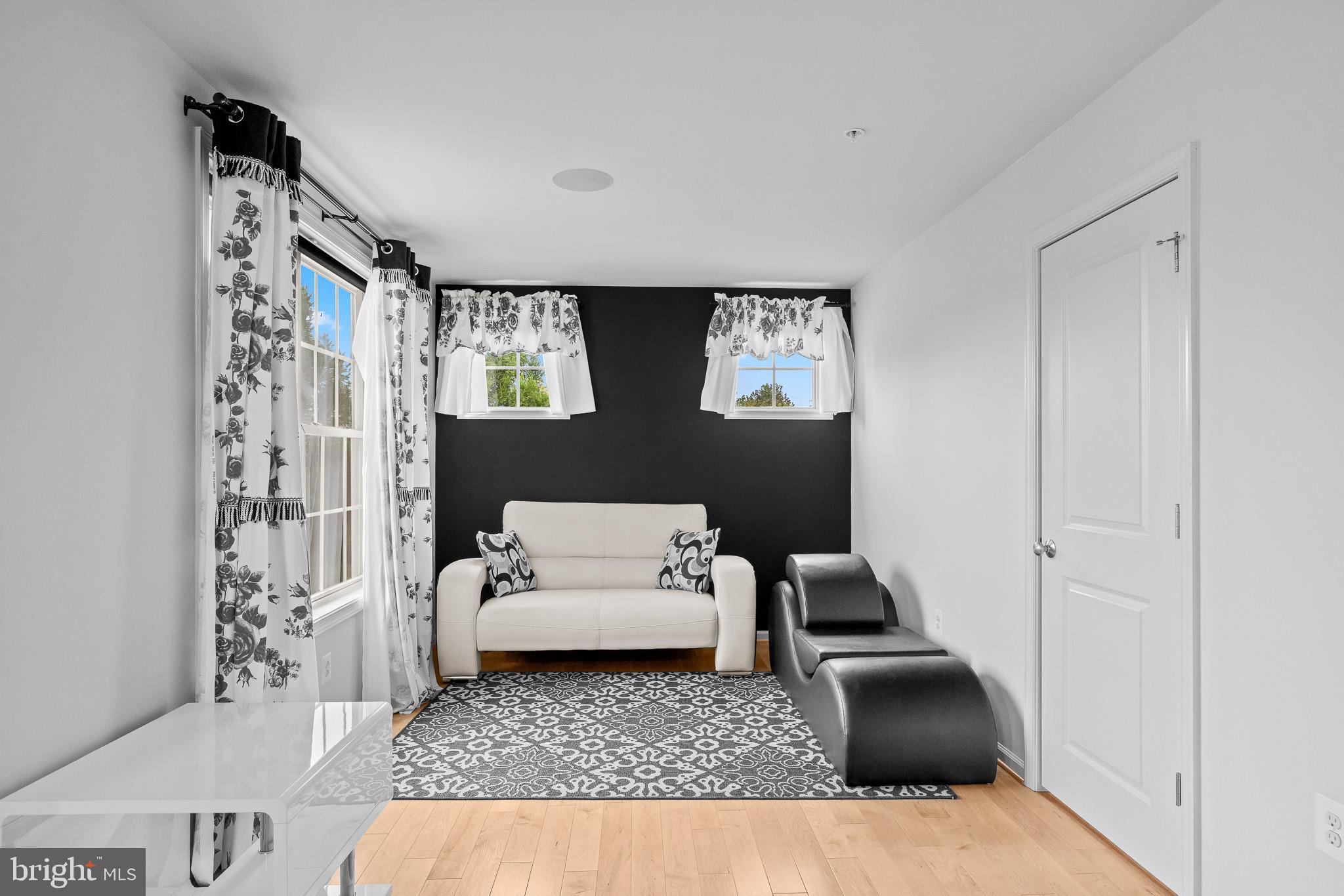 1116 Autumn Brook Avenue Silver Spring, MD 20906 - Photo 37 of 67 a living room with furniture and a rug