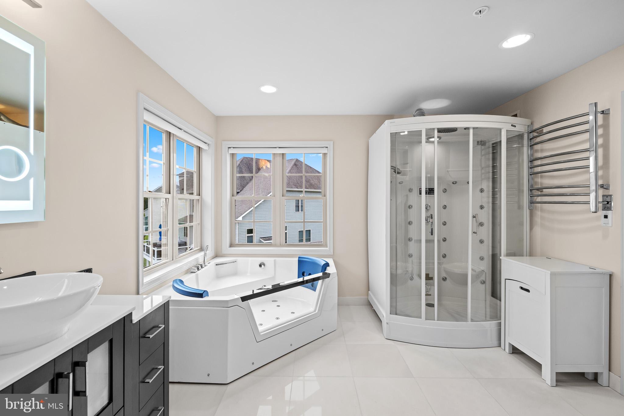 1116 Autumn Brook Avenue Silver Spring, MD 20906 - Photo 43 of 67 a spacious bathroom with a tub sink and shower