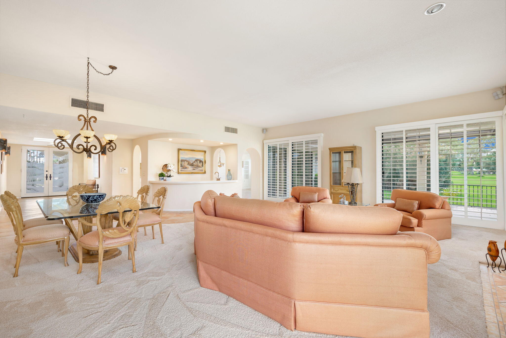 7 Tulane Court Rancho Mirage, CA 92270 - Photo 19 of 66 a living room with furniture and a floor to ceiling window