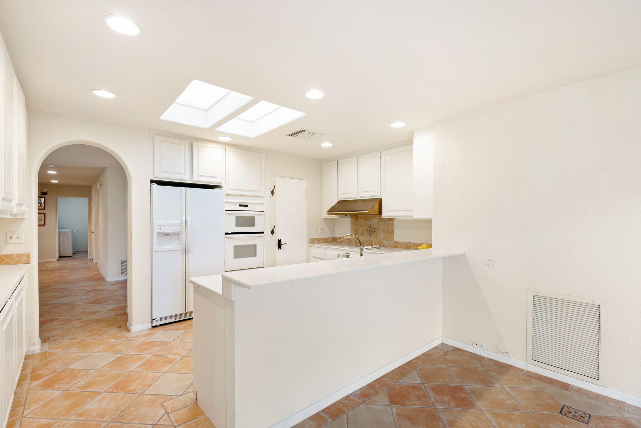 7 Tulane Court Rancho Mirage, CA 92270 - Photo 26 of 66 a view of kitchen with stainless steel appliances refrigerator oven and stove