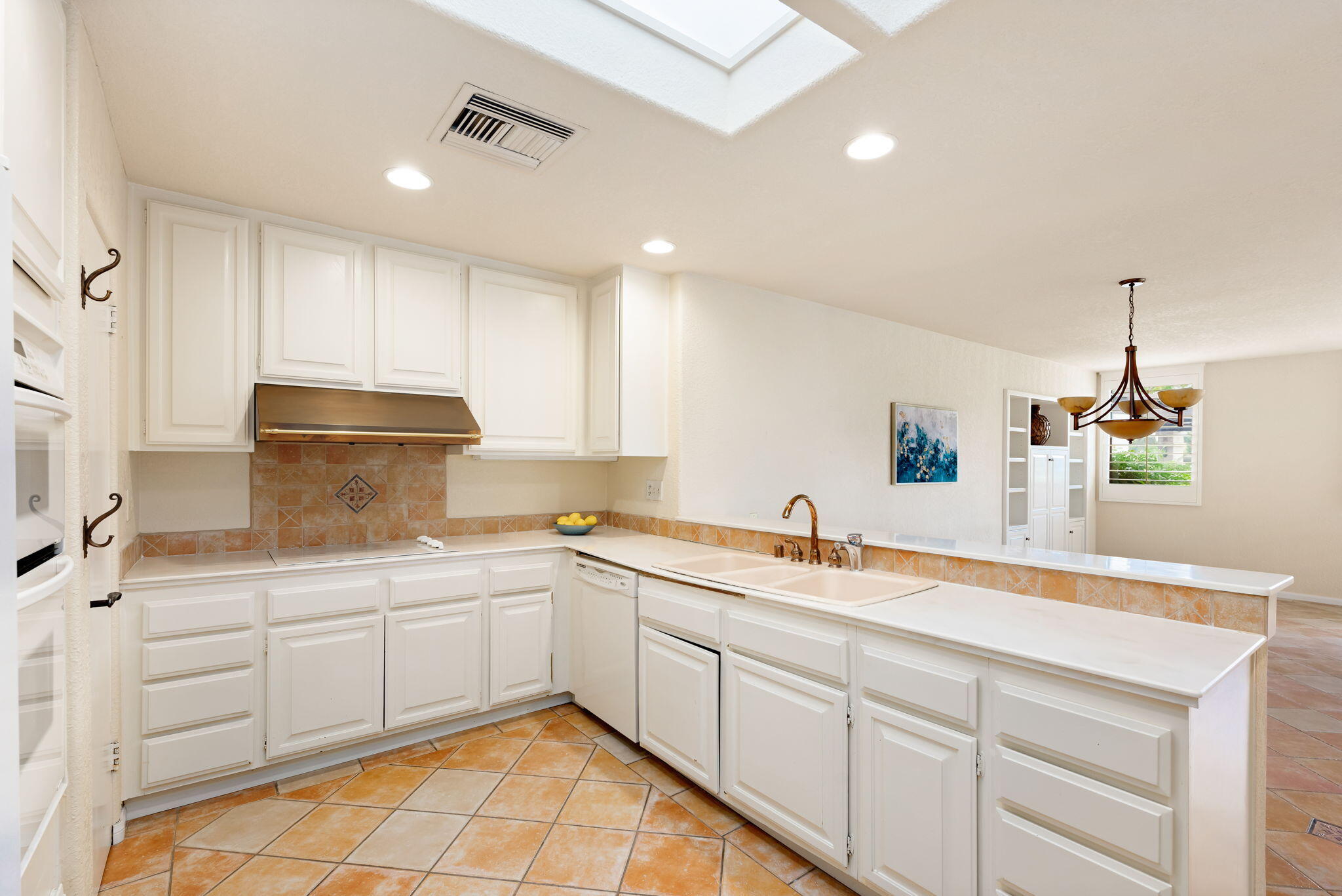 7 Tulane Court Rancho Mirage, CA 92270 - Photo 29 of 66 a kitchen with a sink cabinets and window