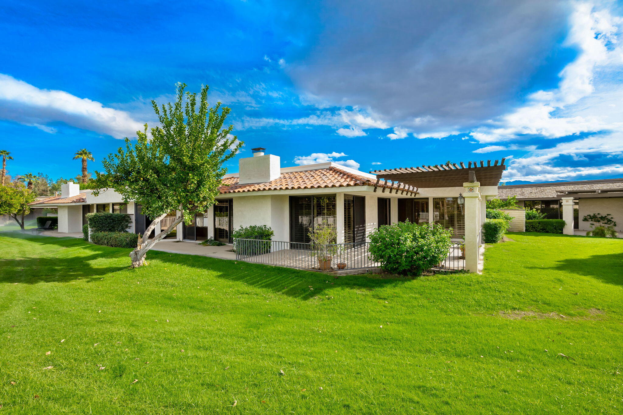 7 Tulane Court Rancho Mirage, CA 92270 - Photo 3 of 66 a front view of a house with a yard and porch