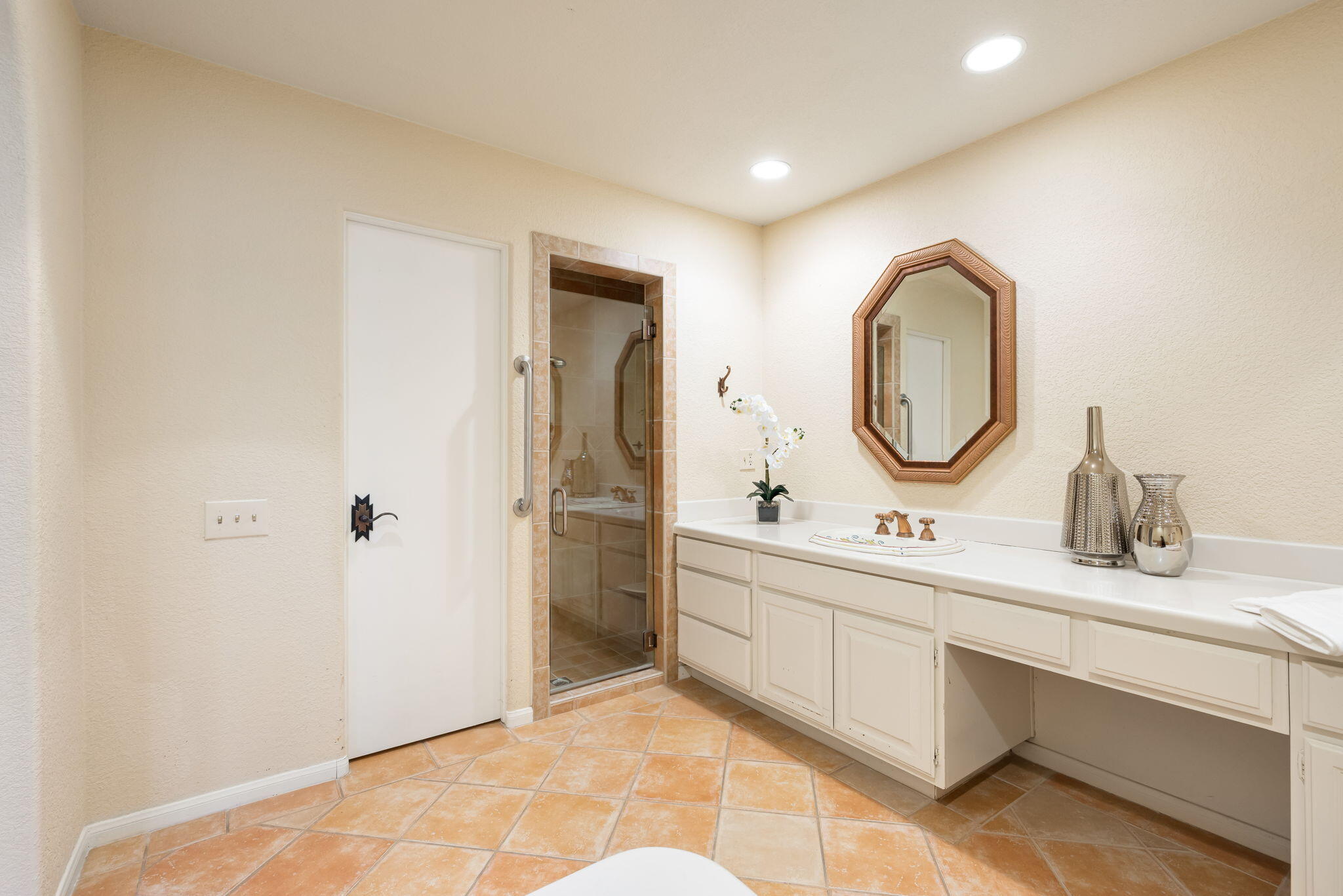 7 Tulane Court Rancho Mirage, CA 92270 - Photo 37 of 66 a bathroom with a double vanity sink mirror and shower