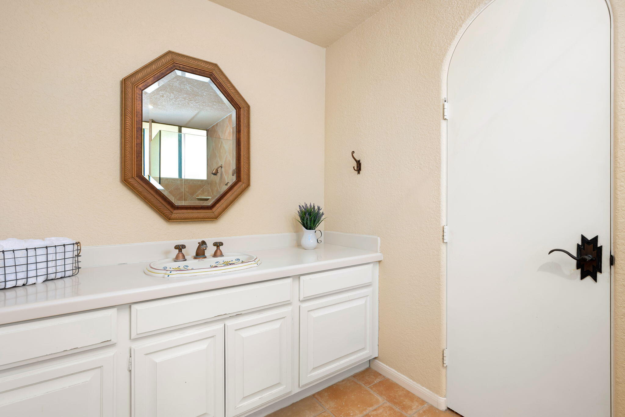 7 Tulane Court Rancho Mirage, CA 92270 - Photo 42 of 66 a bathroom with a sink and a mirror