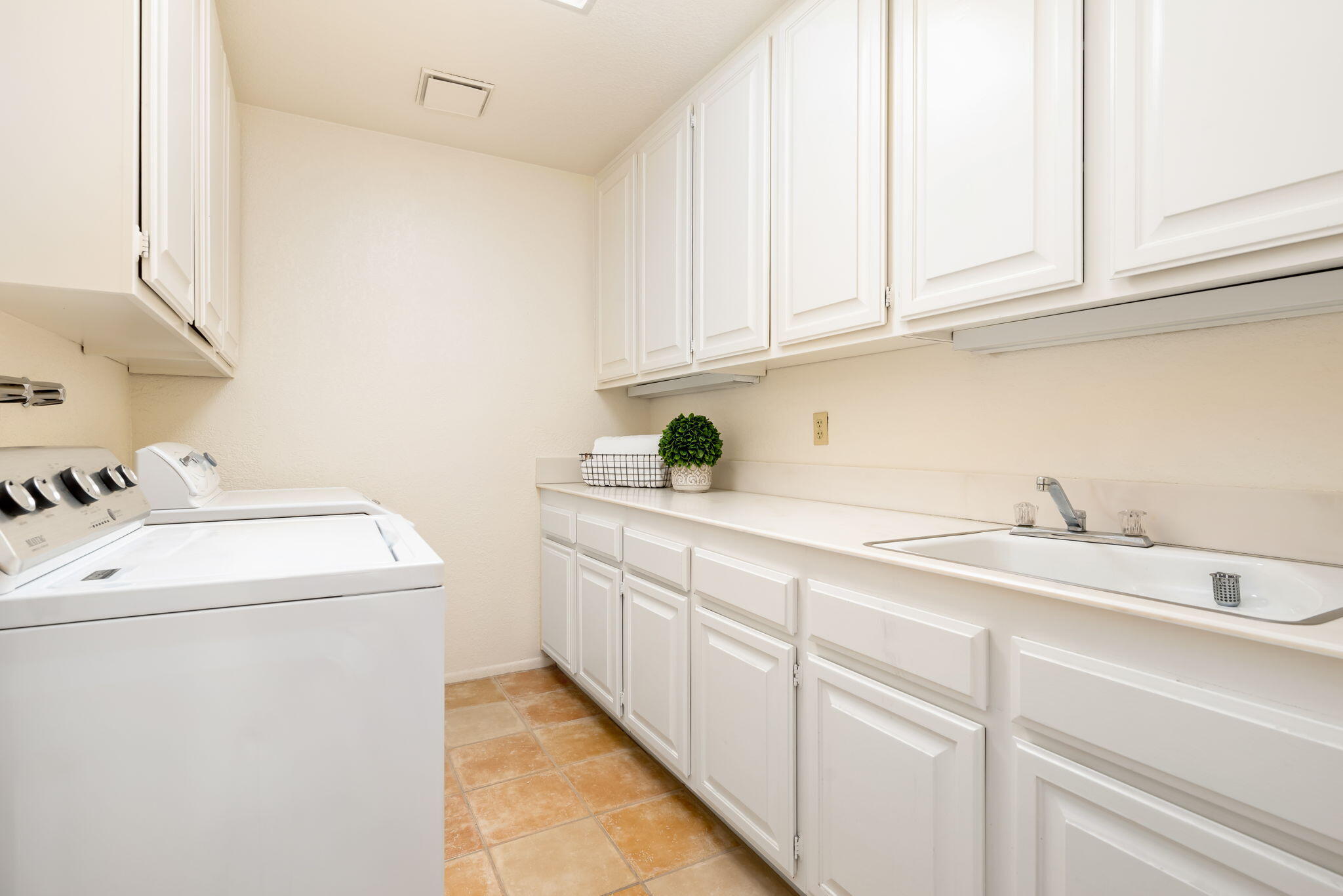 7 Tulane Court Rancho Mirage, CA 92270 - Photo 48 of 66 a utility room with sink dryer and washer