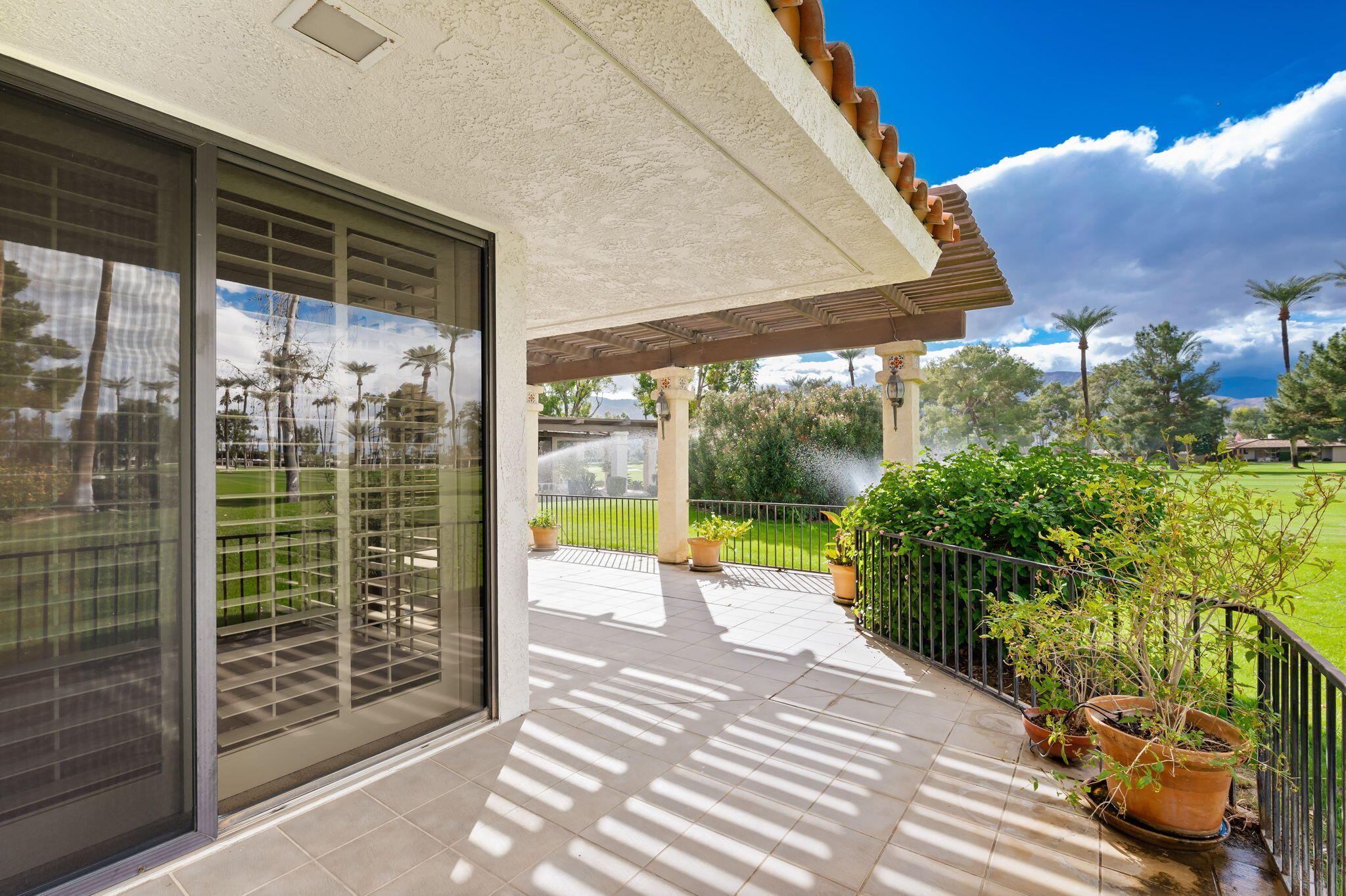 7 Tulane Court Rancho Mirage, CA 92270 - Photo 52 of 66 a view of a porch with furniture and garden