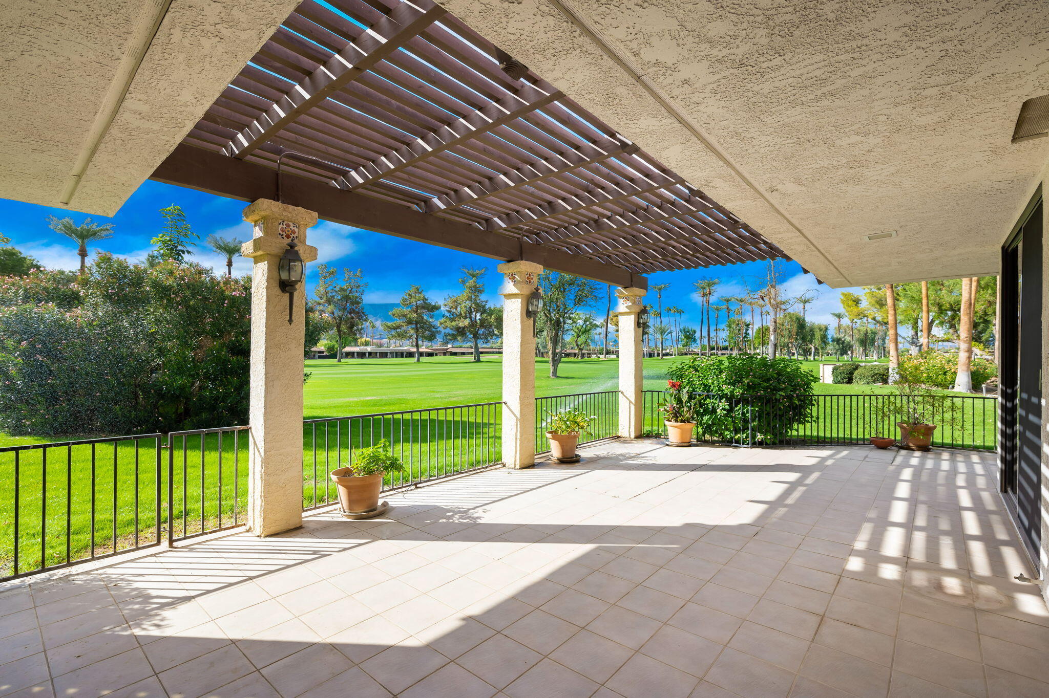 7 Tulane Court Rancho Mirage, CA 92270 - Photo 56 of 66 a view of a house with a big yard potted plants