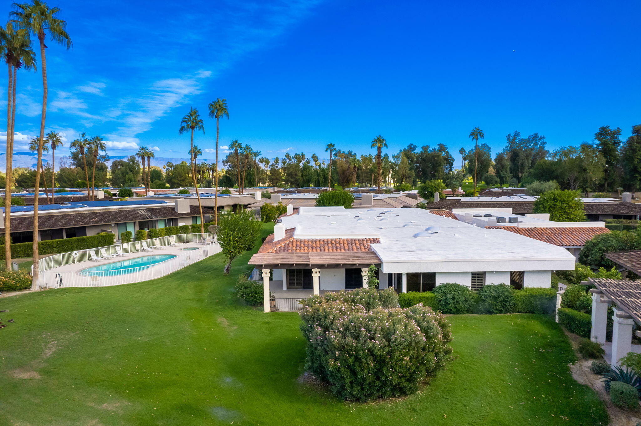 7 Tulane Court Rancho Mirage, CA 92270 - Photo 9 of 66 a view of a house with garden and a swimming pool