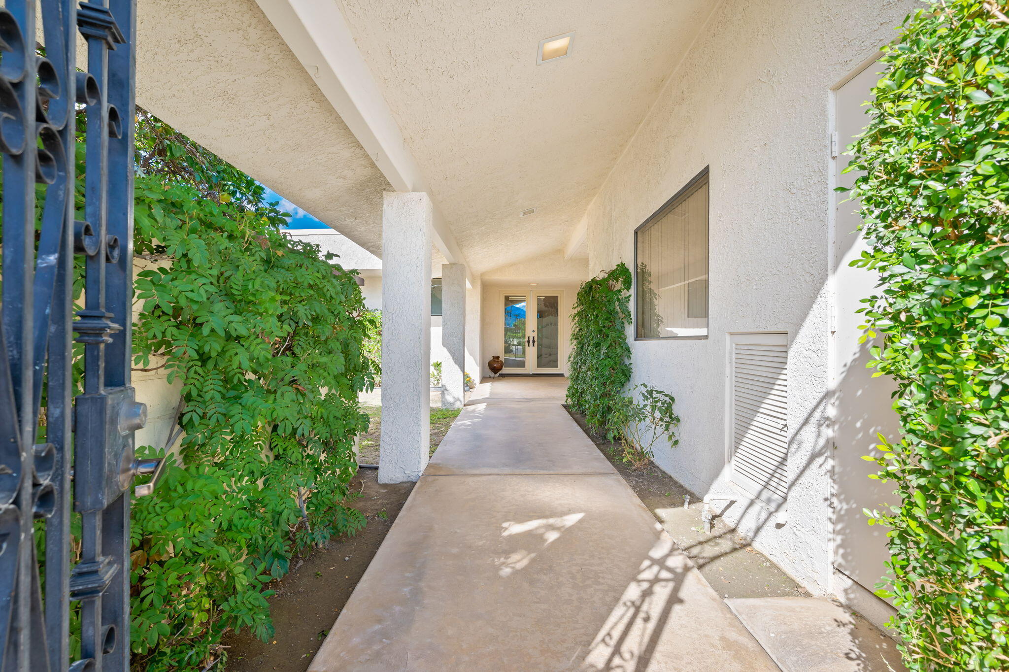 7 Tulane Court Rancho Mirage, CA 92270 - Photo 10 of 66 a view of a house with potted plants
