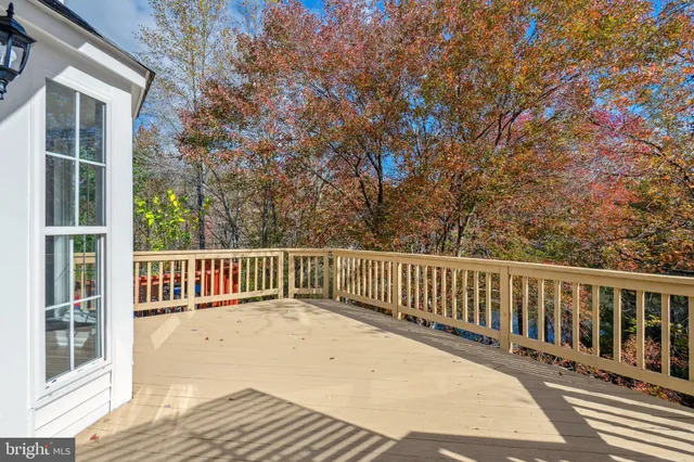 a balcony with view of wooden floor