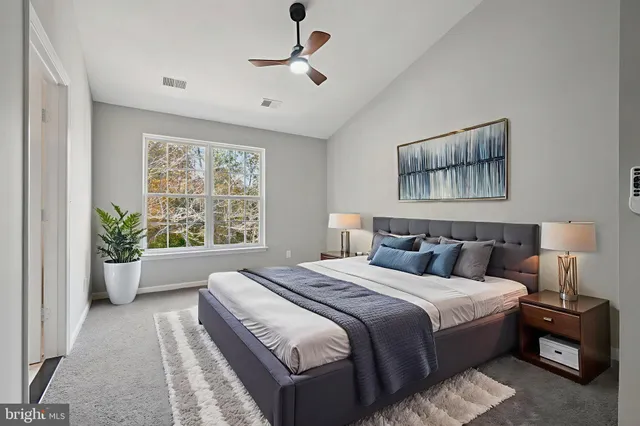 a bedroom with bed and a window