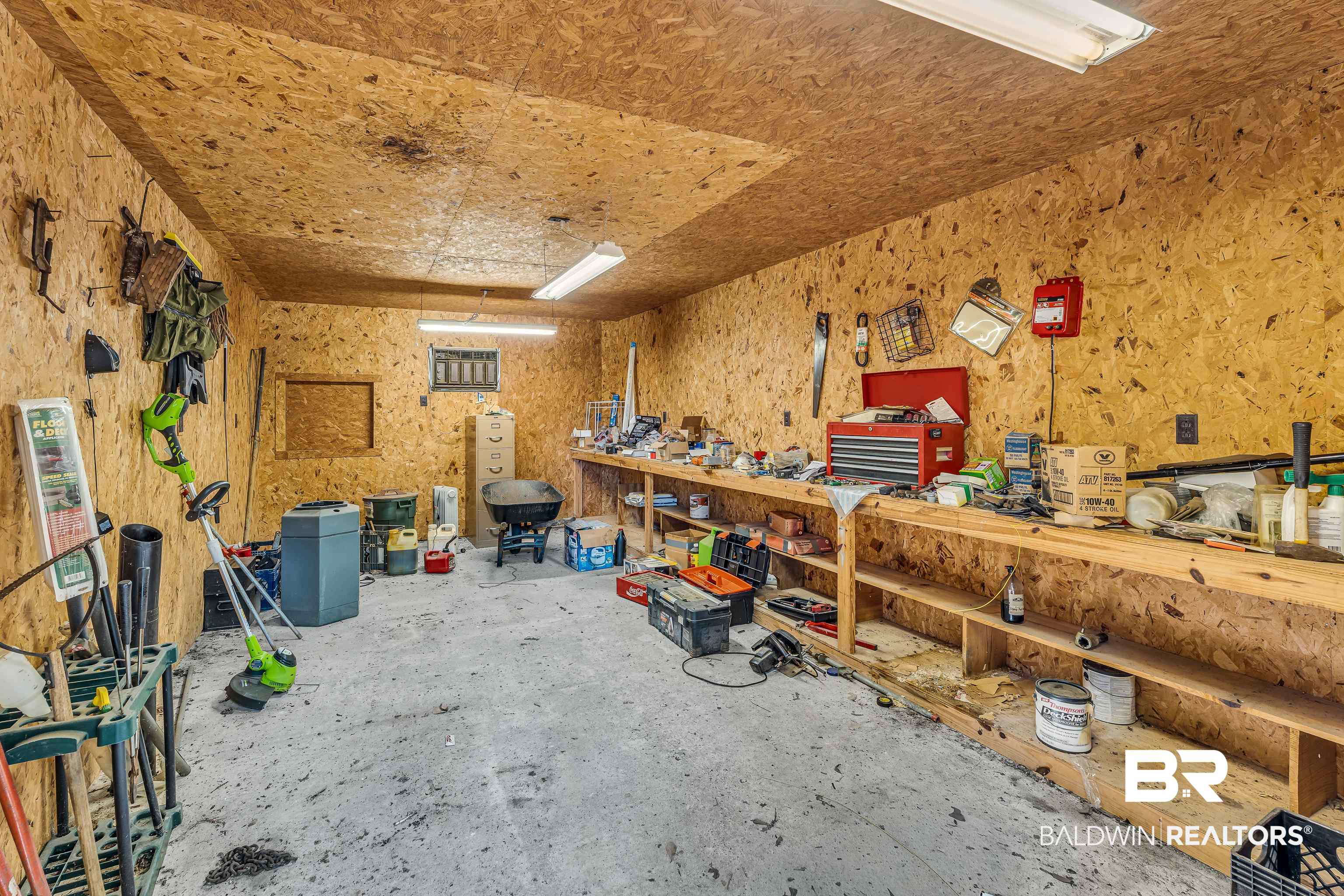 72075 Highway 59 Little River, AL 36550 - Photo 31 of 40 Work Shop with a wall unit AC and roll up door