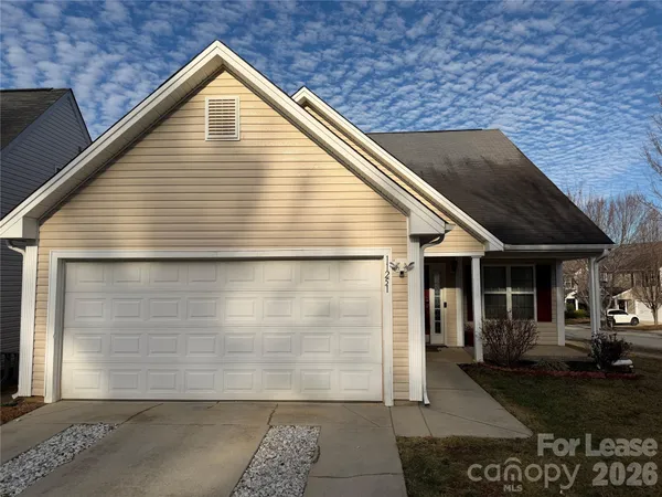 a view of a house with brick walls