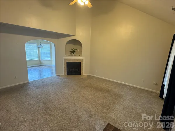 an empty room with a fireplace
