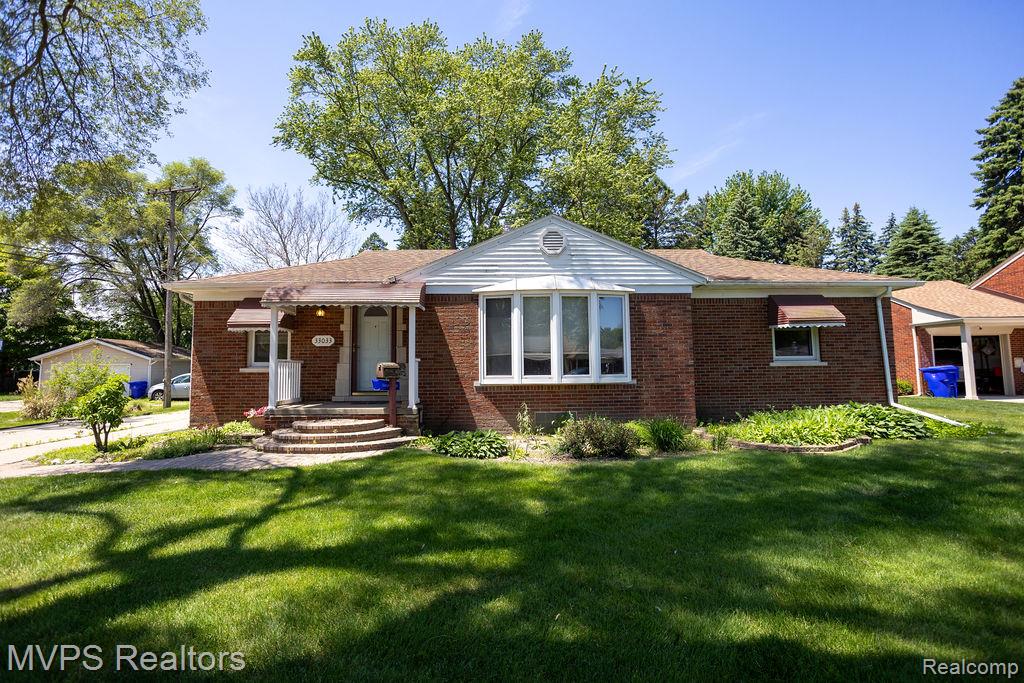 33033 Edgegrove Road Fraser, MI 48026 - Photo 1 of 20 Brick ranch home featuring a bay window, covered front entry, and mature landscaping