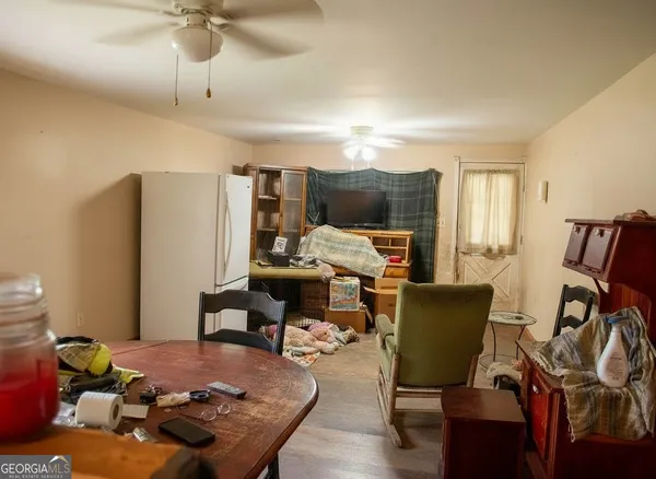 a workspace with furniture window and wooden floor