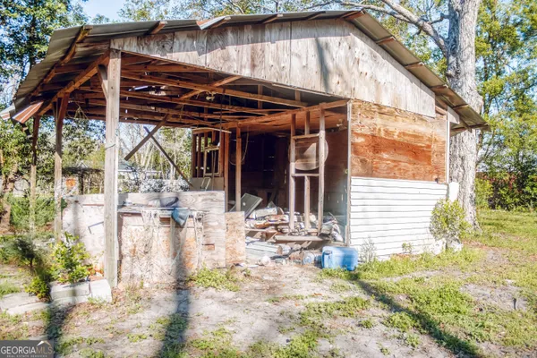 a view of patio with wooden fencing