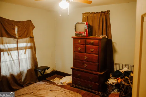 a bed room with a bed and a television